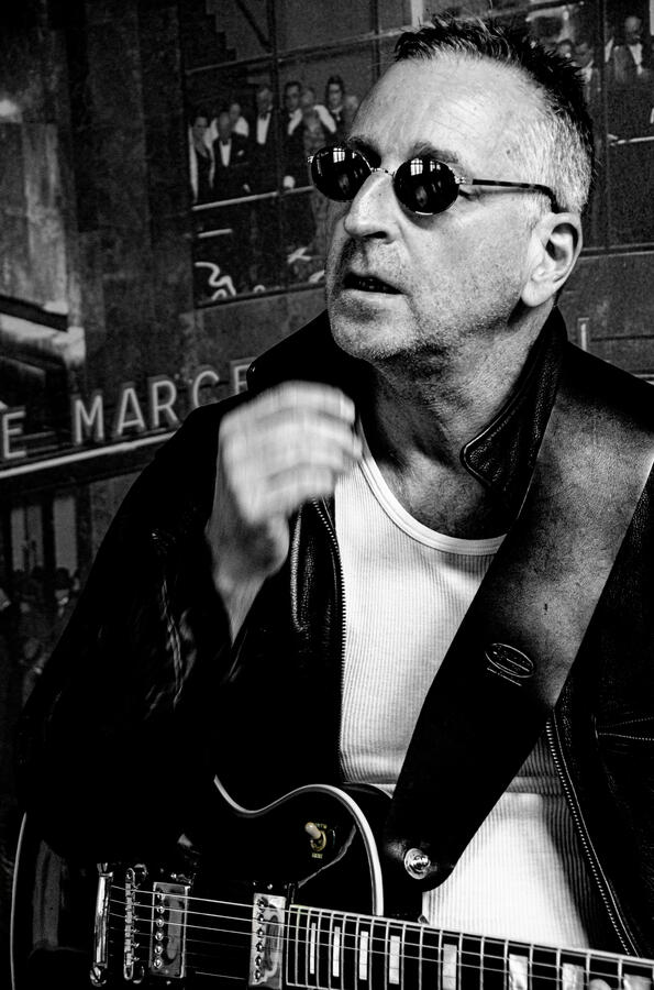 Rock artist portrait in leather jacket, black-and-white. Rock artist portrait in leather jacket, black-and-white.