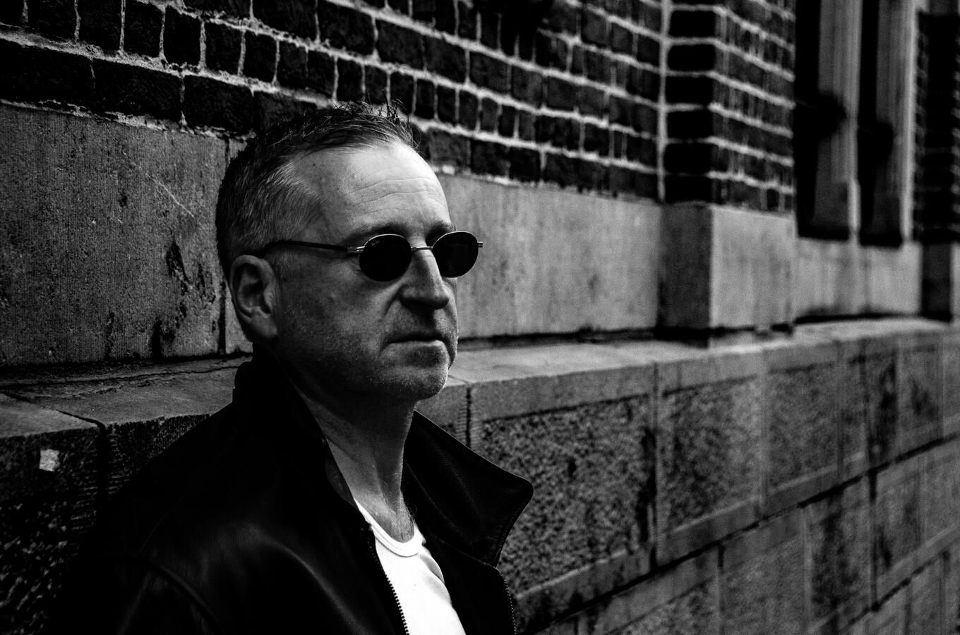 Rock artist portrait in leather jacket, black-and-white. Rock artist portrait in leather jacket, black-and-white.